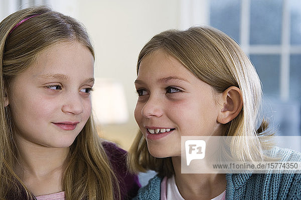 View of two girls smiling.