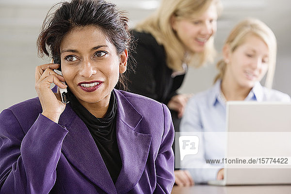 A business woman Conversing on a cellphone.