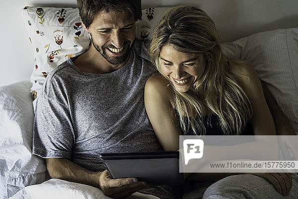 Couple watching movie on digital tablet