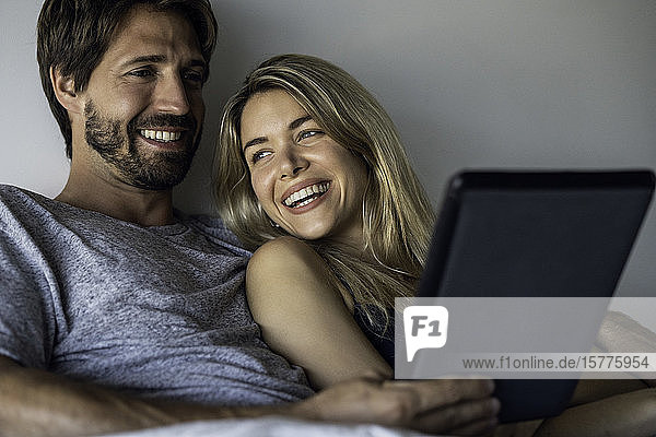 Couple watching movie on digital tablet
