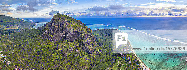 Majestic mountain overlooking the ocean and coral reef aerial panoramic Le Morne Brabant peninsula Mauritius Indian Ocean Africa