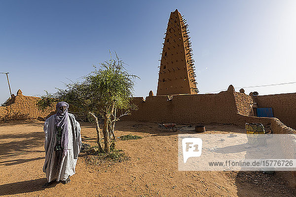 Imam before the Grand Mosque UNESCO World Heritage Site Agadez Niger West Africa Africa