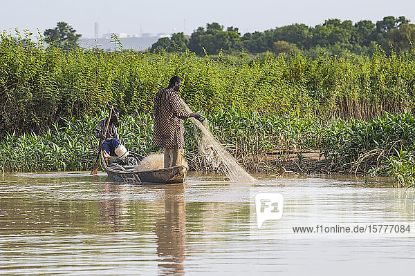 Fishermen in their canoe Niger river Niamey Niger West Africa Africa