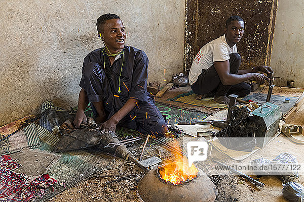 Man working on Jewllery in the UNESCO World Heritage Site Agadez Niger West Africa Africa