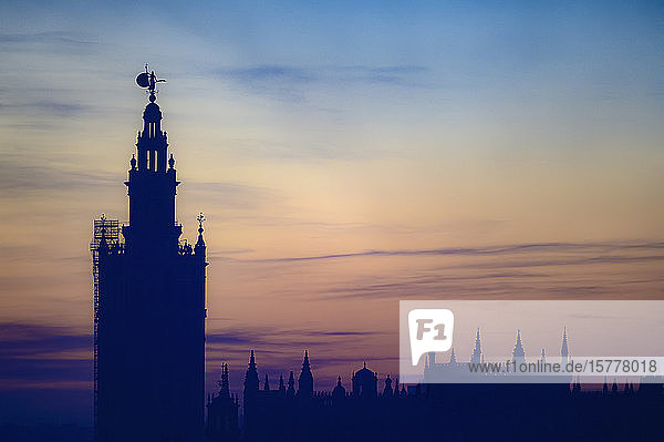 Giralda bell tower at sunset in Seville Spain