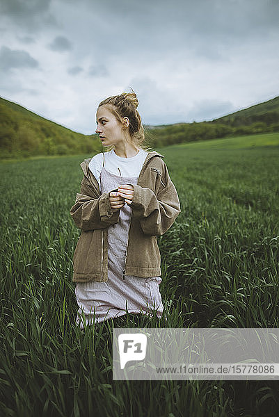 Woman wearing jacket in field in Crimea Ukraine
