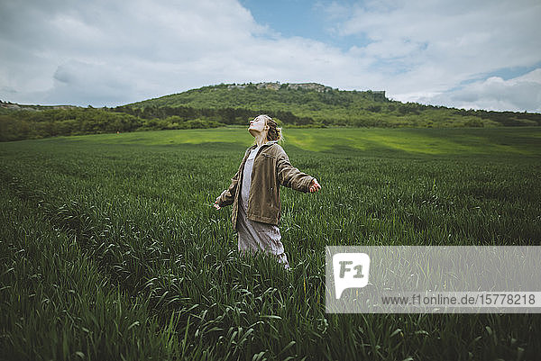 Woman wearing jacket in field in Crimea Ukraine