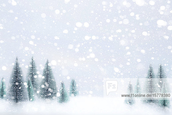 Snow falling on Christmas tree ornaments