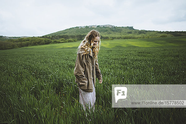 Woman wearing jacket in field in Crimea Ukraine