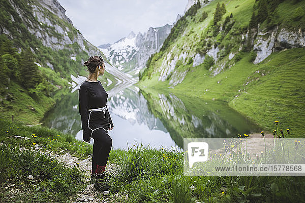 Woman by mountains and lake in Appenzell Switzerland