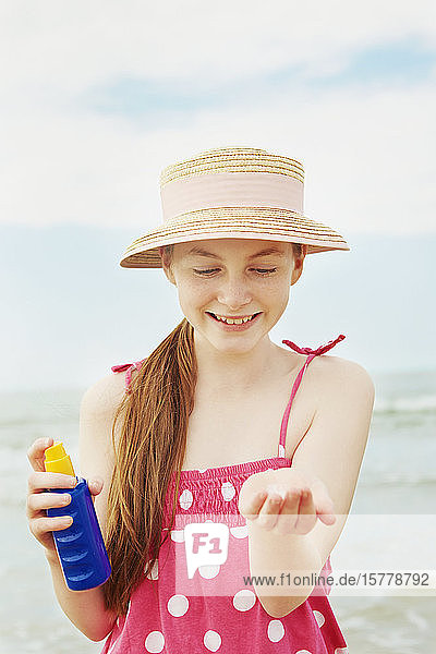 Girl using sun cream
