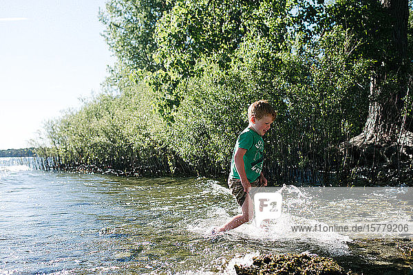 Boy running in water  Kingston  Canada