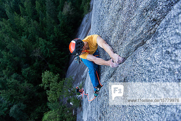 A climber traditional climbing on granite Tantalus Wall Squamish