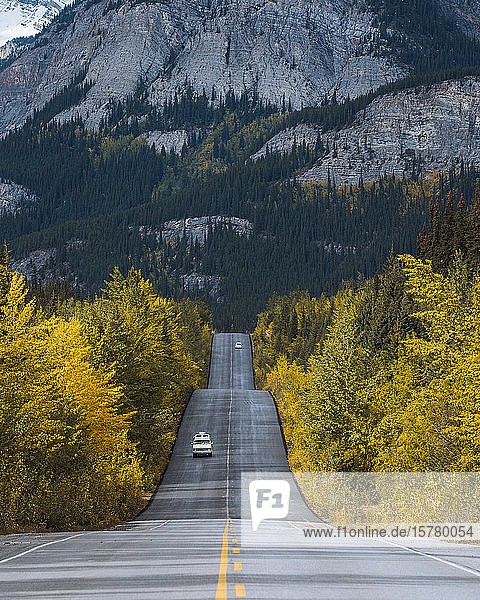 Campervan driving through Icefields Parkway in fall  Alberta  Canada