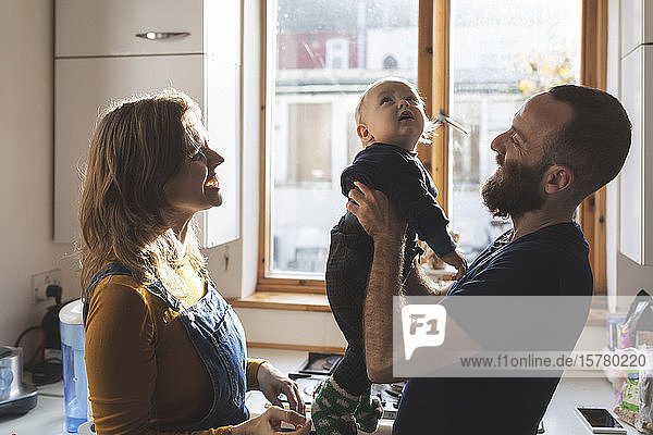 Happy family in the kitchen at home