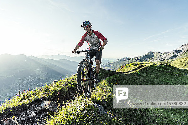 Mountainbiker on a way in Grisons  Switzerland