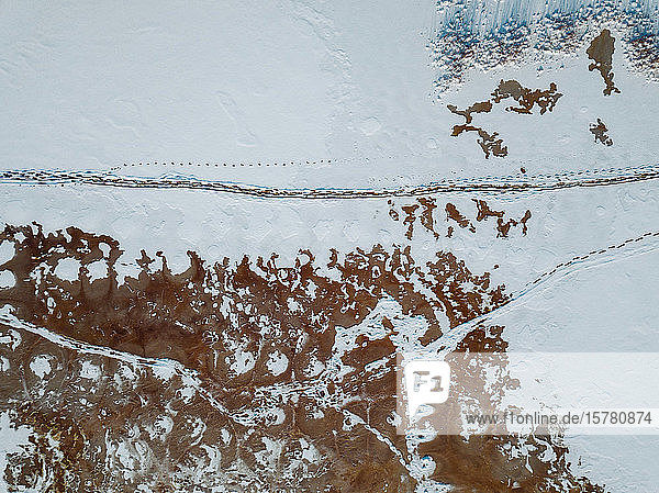 Russia Leningrad Region Tikhvin Aerial view of ice at Tikhvinka River in Winter