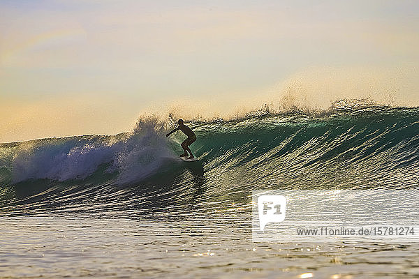 Surfer in the evening Bali Indonesia