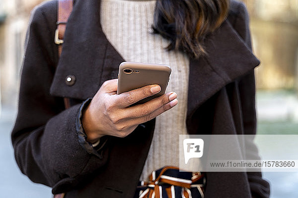Close-up of woman holding smartphone