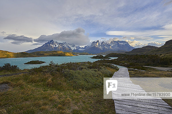 Chile  Ultima Esperanza Province  Boardwalk along shore of Lake Pehoe with Cuernos del Paine in background