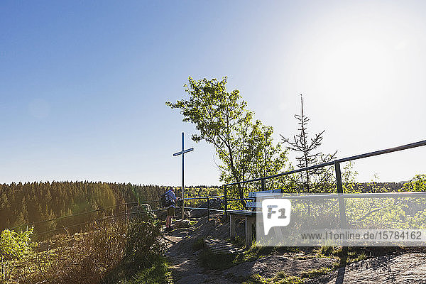 Germany Eifel Eifel Monschau region Monschauer Land Oberes Rurtal Summit cross on the Ehrensteinley hiker writing in summit cross visitor book