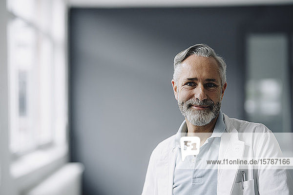 Portrait of smiling mature doctor