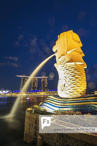 Merlion fountain and Marina Bay Sands at night Singapore Republic of Singapore.