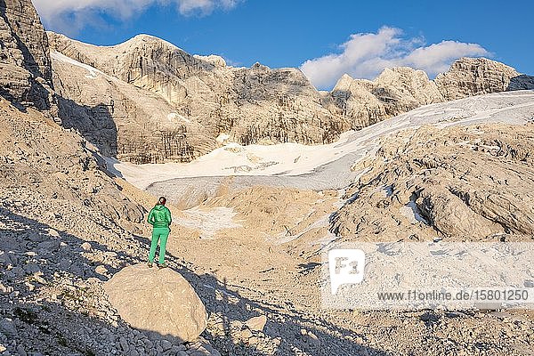 Hiker looks at alpine landscape  Great Gosau Glacier  Hohes Kreuz  Hoher and Niederer Dachstein  Salzkammergut  Upper Austria  Austria  Europe