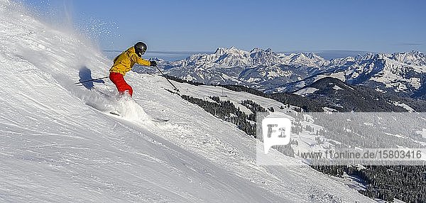 Skier  Hohe Salve ski run  Loferer Steinberge at the back  Skiwelt Wilder Kaiser Brixenthal  Hochbrixen  Tyrol  Austria  Europe