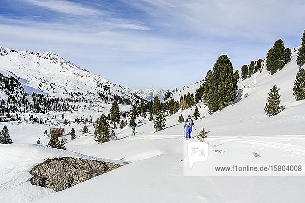 Ski tourers in a snowy mountain landscape  Wattentaler Lizum  Tuxer Alps  Tyrol  Austria  Europe