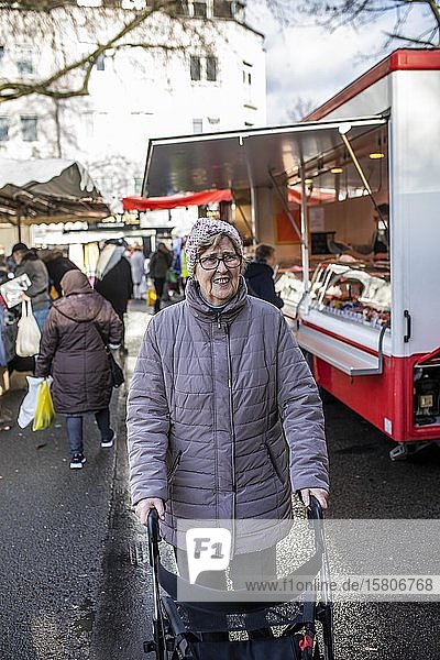 Senior citizen with walker at the weekly market market  Cologne  North Rhine-Westphalia  Germany  Europe