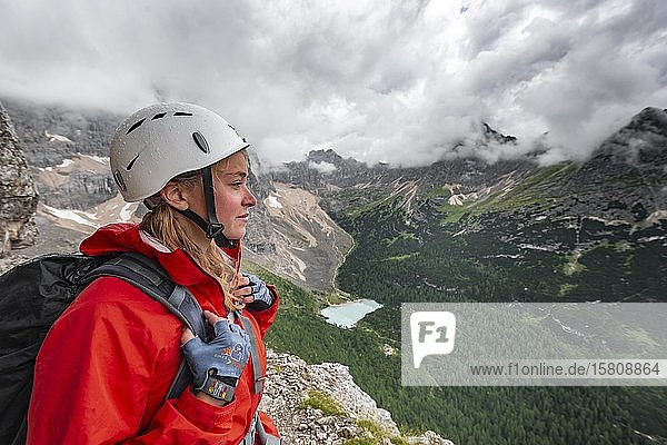 Young woman  hiker looking over mountain landscape  Via ferrata Vandelli  Sorapiss circuit  Dolomites  Belluno  Italy  Europe