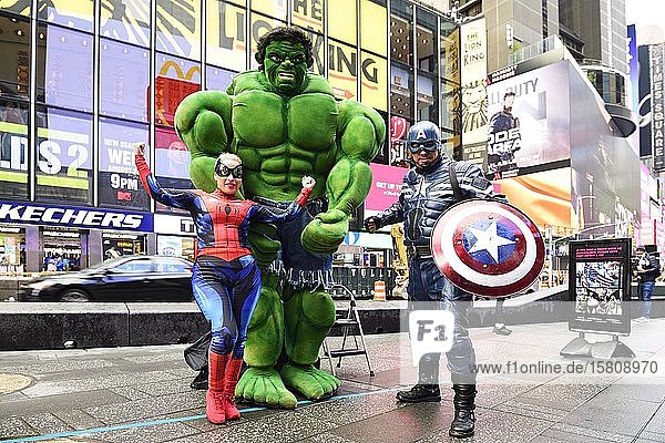 Marvel figures Hulk Spiderman and Captain America can be photographed with tourists Times Square Manhattan New York City New York State USA North America