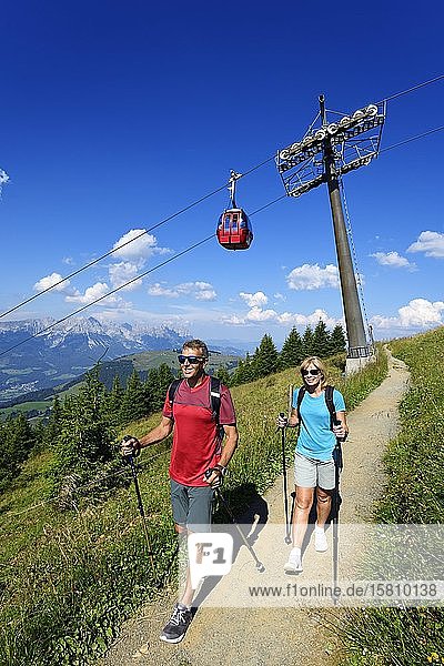 Hikers on the summit panorama trail of the Hohe Salve Hopfgarten Brixental Kitzbühel Alps Tyrol Austria Europe