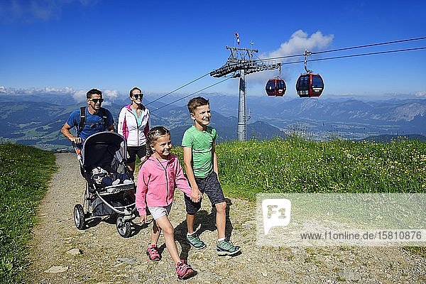 Family hiking on the summit panorama trail of the Hohe Salve Hopfgarten Brixental Kitzbühel Alps Tyrol Austria Europe