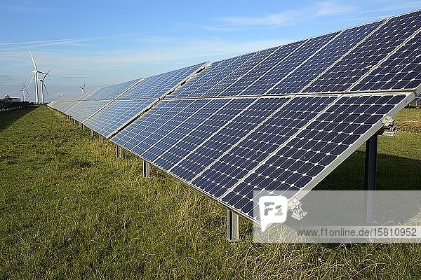 Renewable energies: photovoltaic system  solar power plant and wind farm in the background  Schleswig-Holstein  Germany  Europe