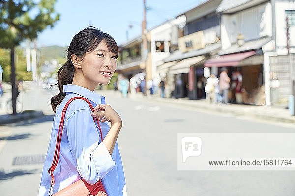 Young Japanese woman traveling in Kyoto