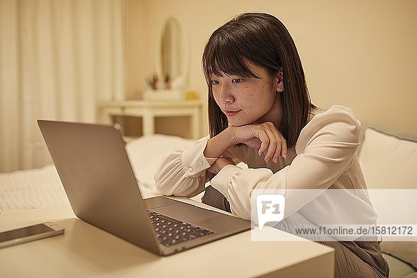 Young Japanese woman in her house