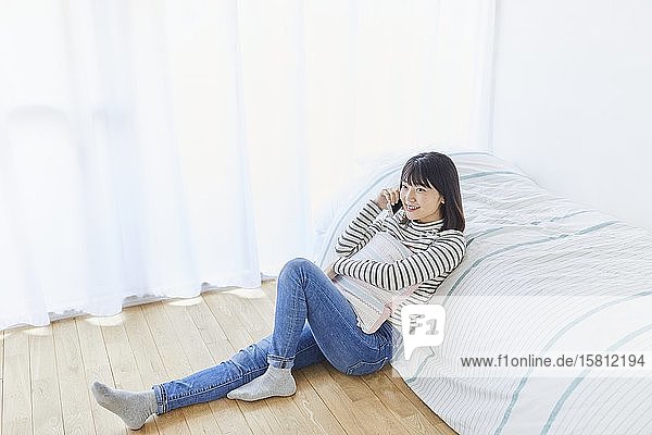 Young Japanese woman in her house