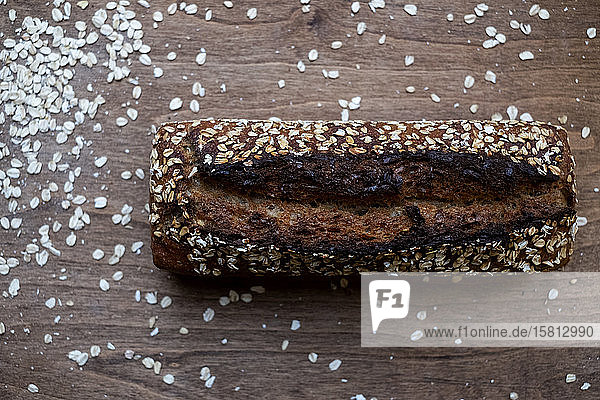 High angle close up of freshly baked seeded loaf of bread in an artisan bakery.