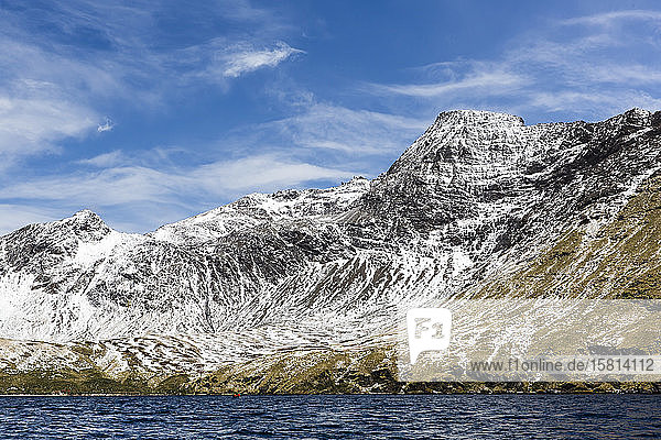 Fresh dusting of snow on the mountains surrounding Godthul South Georgia UK Overseas Protectorate Polar Regions