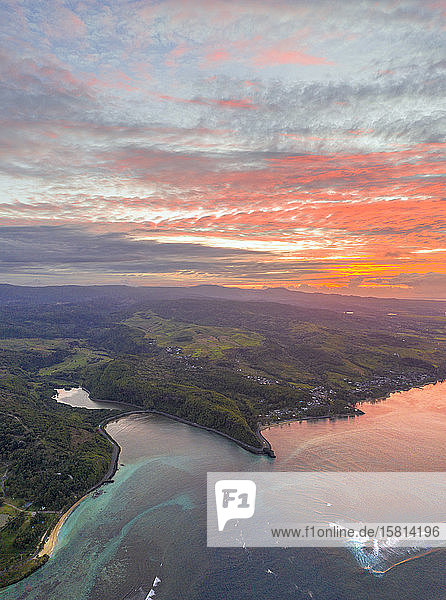 Sunrise over the ocean along south coast aerial view by drone Baie Du Cap Mauritius Indian Ocean Africa