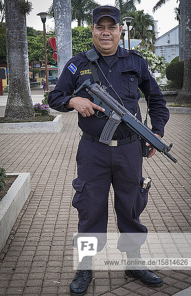 An armed policeman in El Salvador  Central America