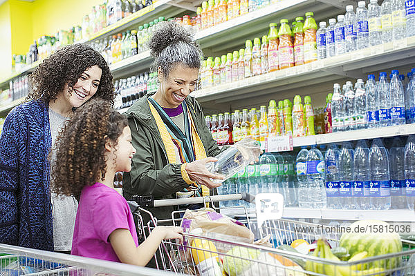 Multi-generation women shopping in supermarket