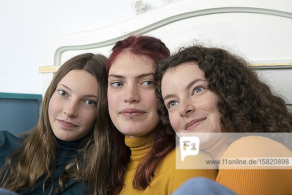 Portrait of three happy sisters