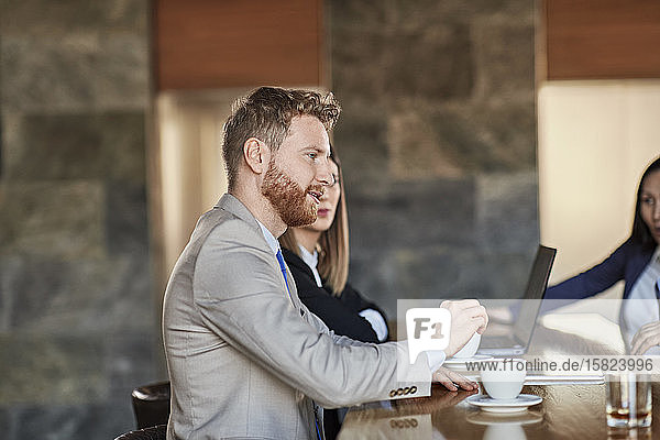 Business people having a meeting in hotel lobby