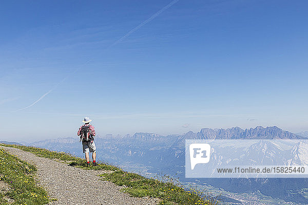 Switzerland  St Gallen Canton  Glarus Alps  Man hiking the Panoramic hiking trail in the Tectonic Arena Sardona