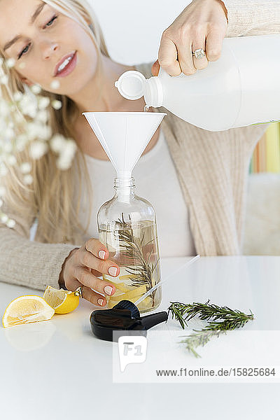 Woman making a homemade natural cleaner