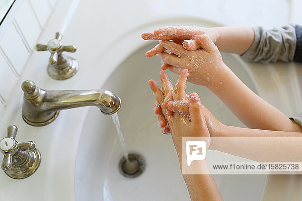 Close-up of children (4-5 6-7) washing hands