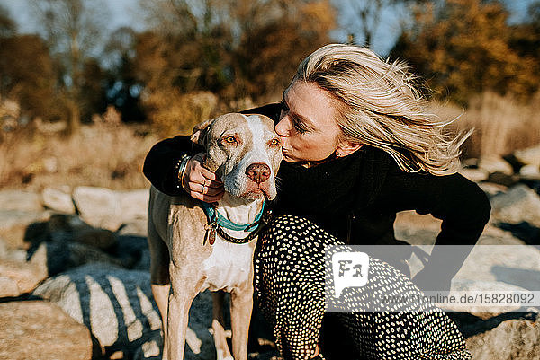 portrait of dog and woman in sunshine